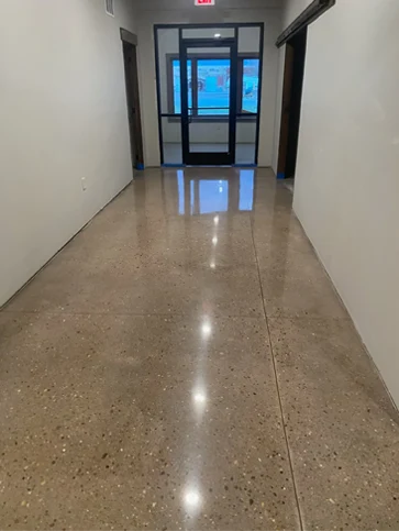 Mobius Polished Concrete - Photo depicts hallway that has polished concrete finish